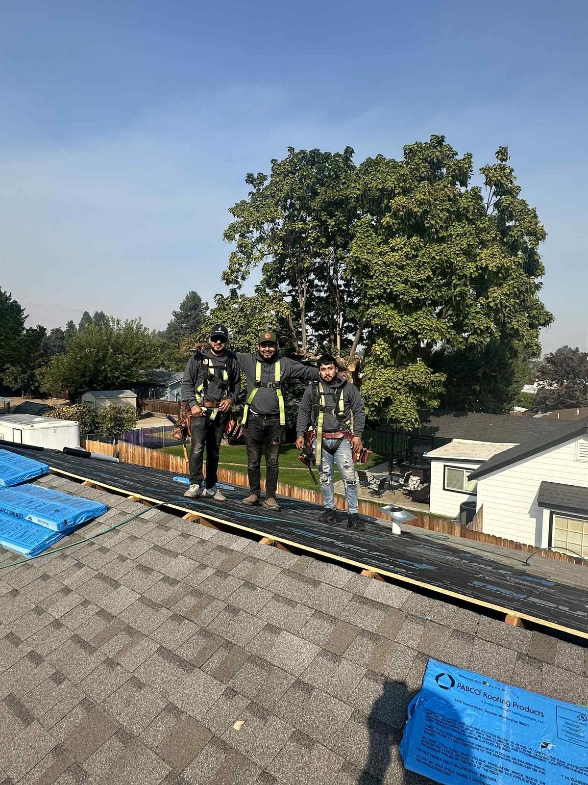 Essence Roofing crew working on a roof