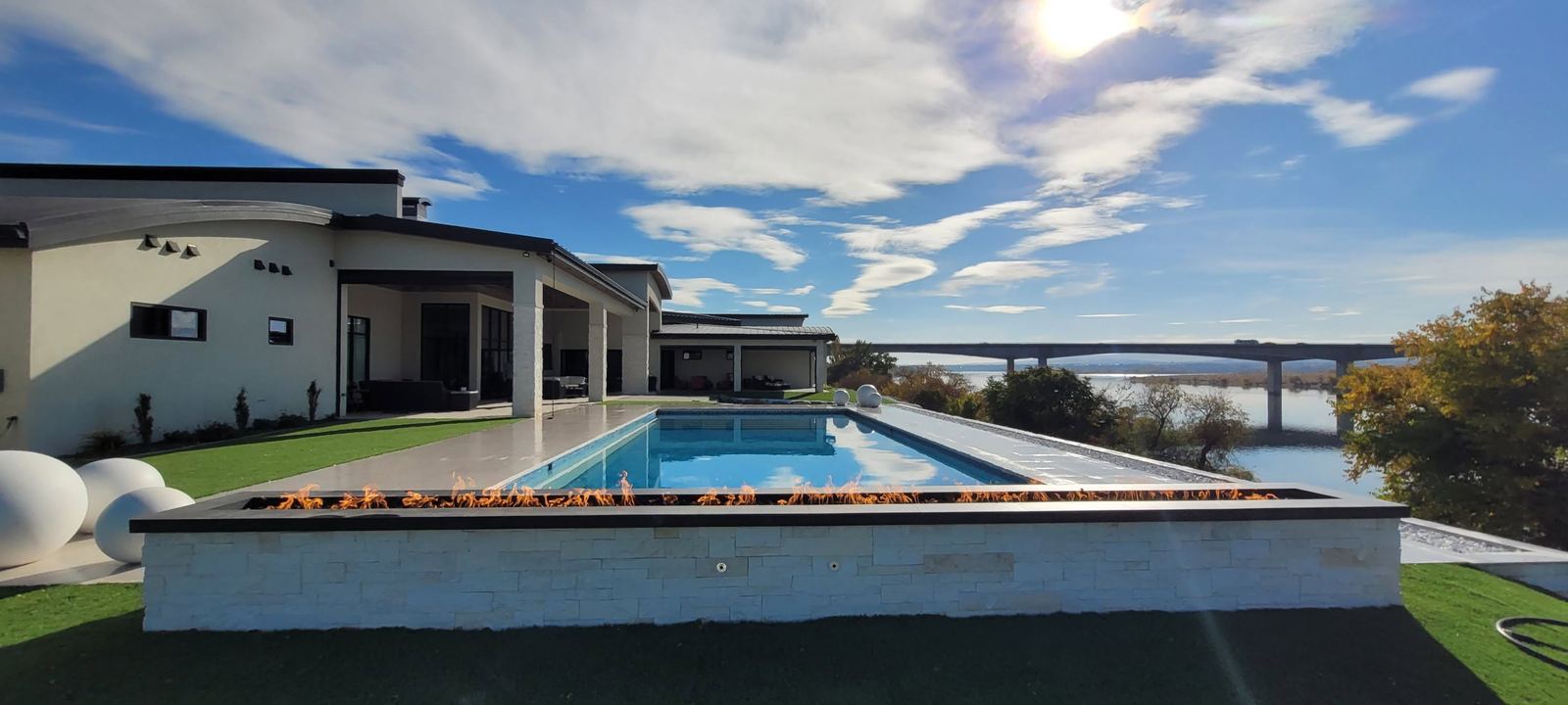Completed infinity pool and fire feature
