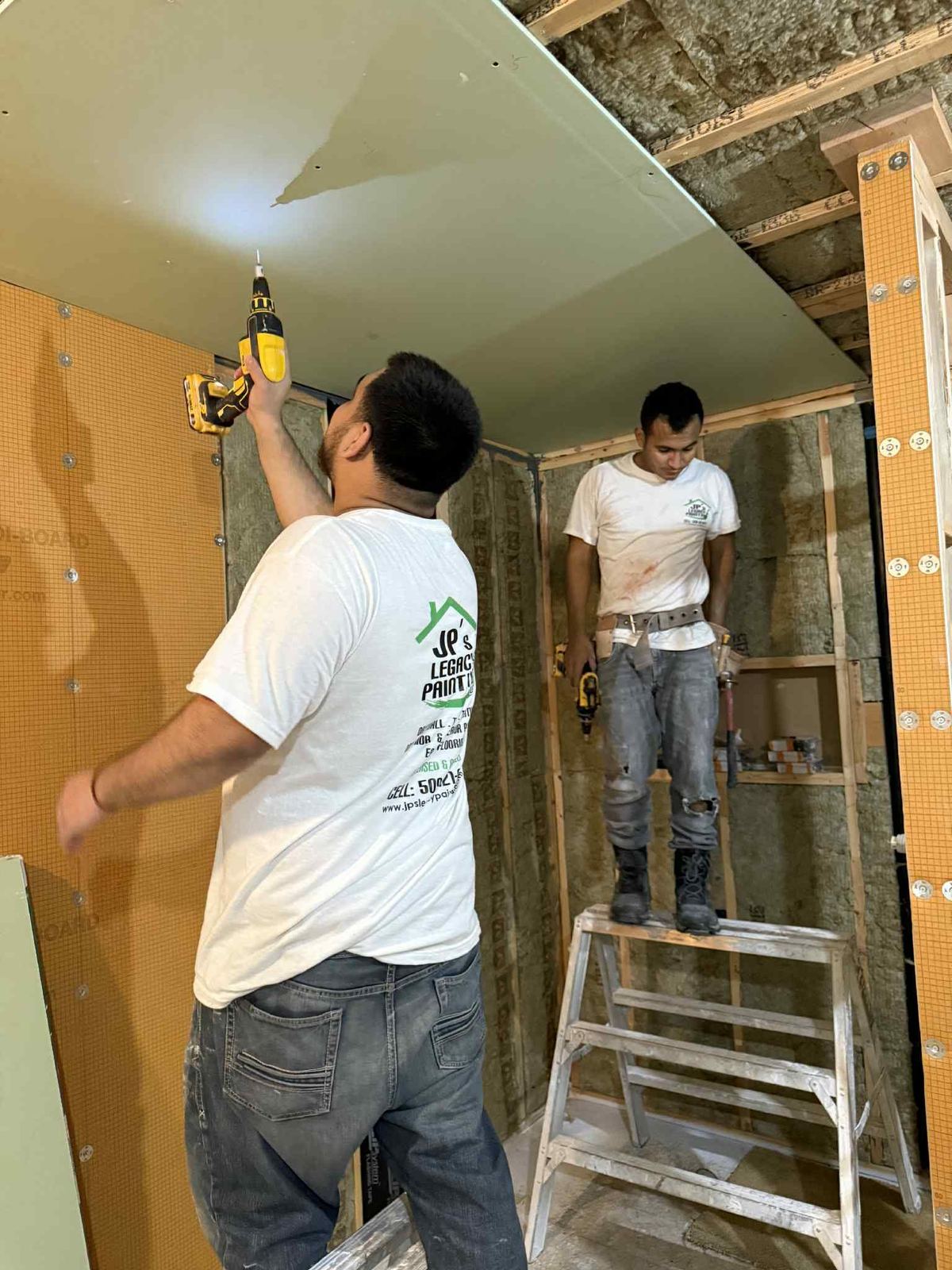 Crew hanging drywall