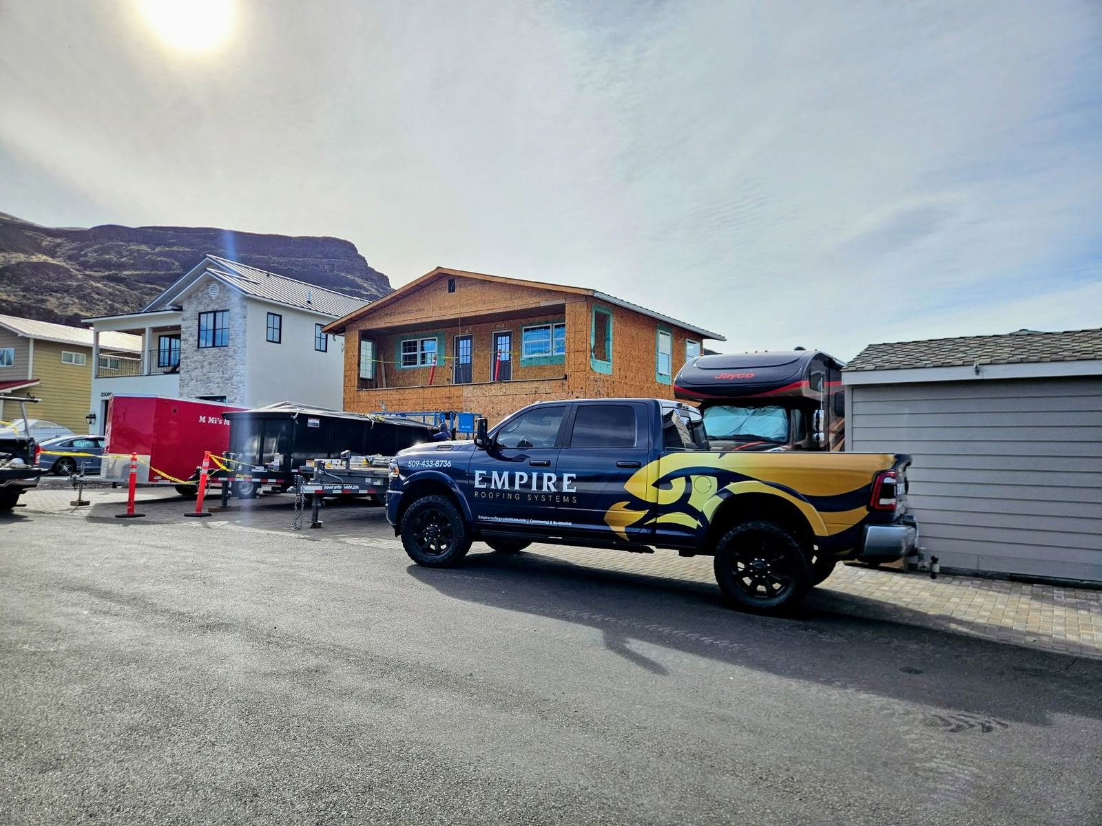 Empire Roofing Systems truck on the jobsite