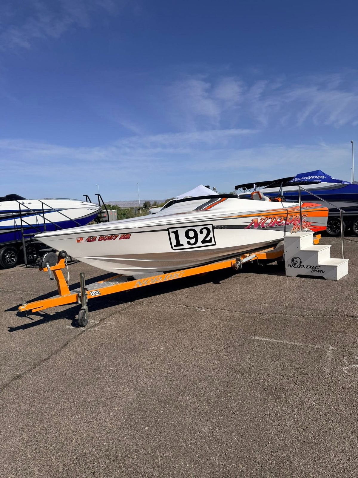 Race boat on its trailer at a boat show
